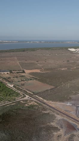 coastal landscape with farmland and vegetation