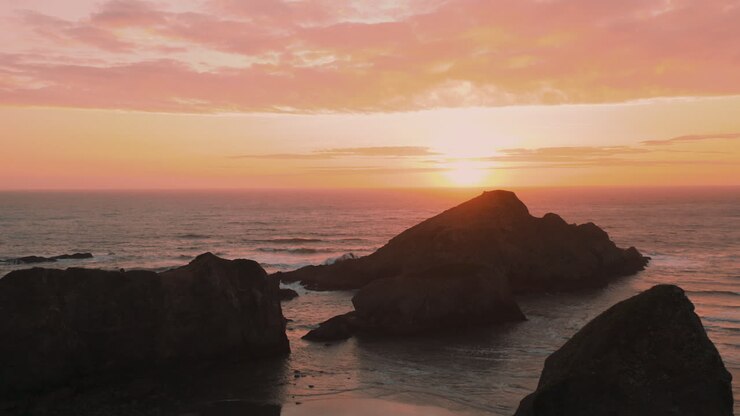 Drone ascending next to sea stacks at Myers Creek near Gold Beach, Southern Oregon, USA