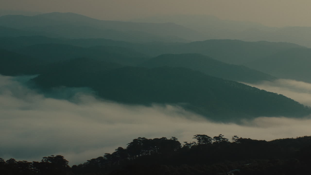 Misty Mountain Range at Sunrise