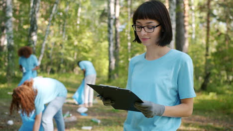 community volunteer group cleaning up a forest