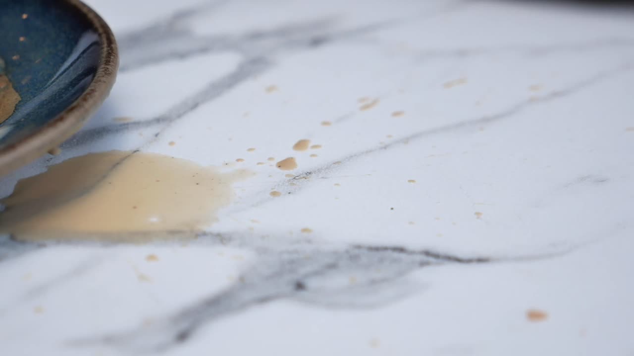 Spilled coffee on a marble table
