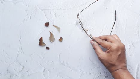 broken eye glass on table with copy space