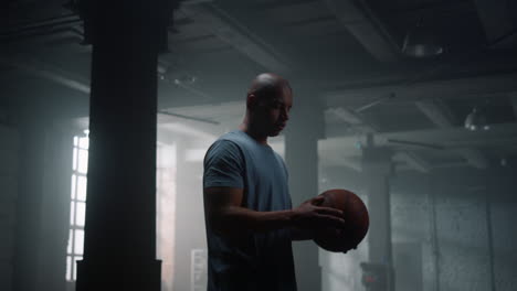 Guy-spinning-basketball-ball-on-finger.-Player-balancing-ball-on-finger