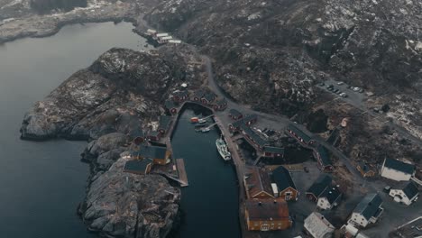 harbor and fishing village of nusfjord along vestfjorden in winter in flakstadoya, norway. - aerial shot