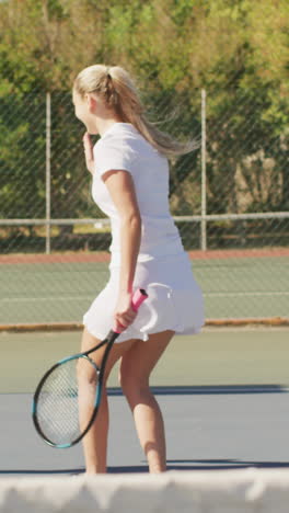 video of happy diverse female tennis players holding rackets and shaking hands