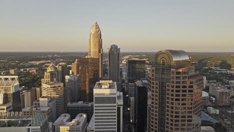 charlotte north carolina aerial v149 low flyover the city center, weaving between towering skyscrapers capturing downtown cityscape at sunset golden hour - shot with mavic 3 pro cine - oct 1st 2023