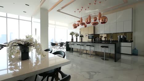 fully decorated kitchen area with counter bar, dinning area and stools