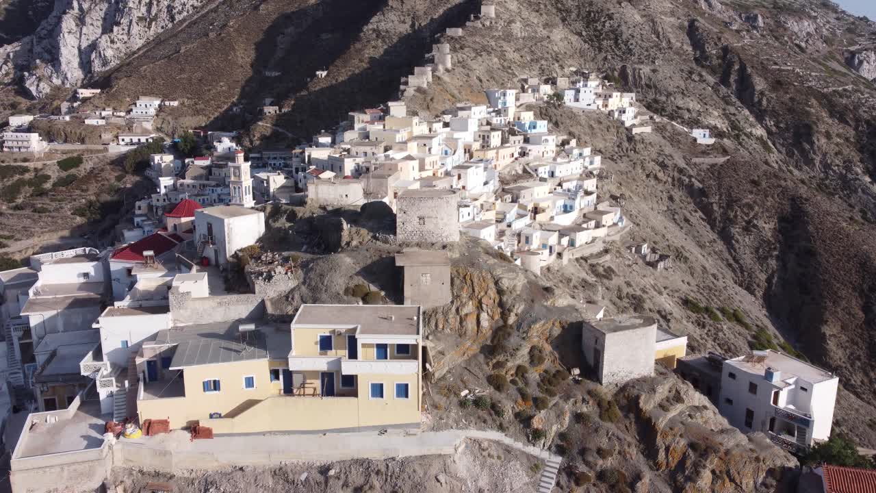 Ascending 4k Cinematic Aerial drone video revealing Colorful Houses and Mountain of Olympos Village, Karpathos