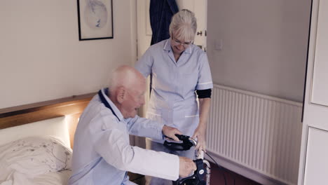 elderly man receiving care from a nurse with a walker in a bedroom