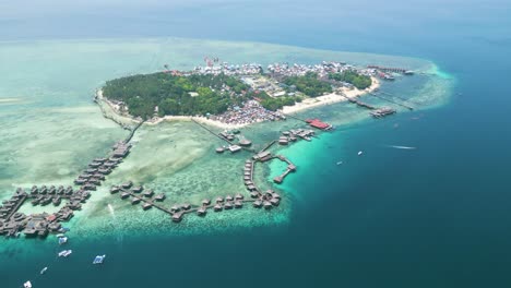 aerial of sabah's mabul island, captivating scenery of the bajau community and the water village resort, presenting a dynamic tapestry of life in this coastal haven of malaysia