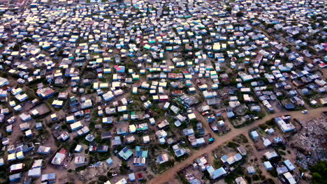 overpopulation in squatter camp with makeshift houses, poverty in rsa. drone