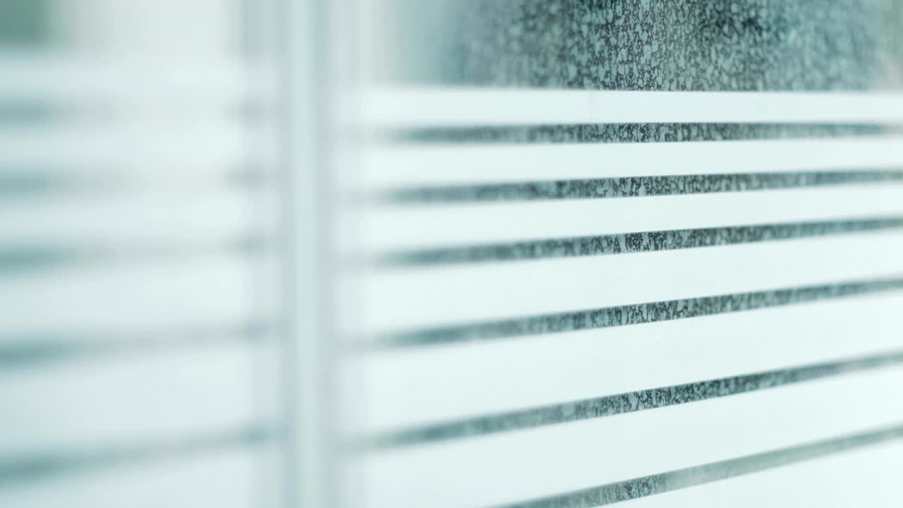 Male Figure Peering Through Window