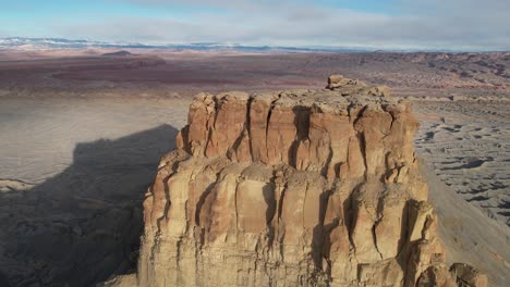 drone shot of factory butte, stunning natural landmark in desert landscape of utah usa