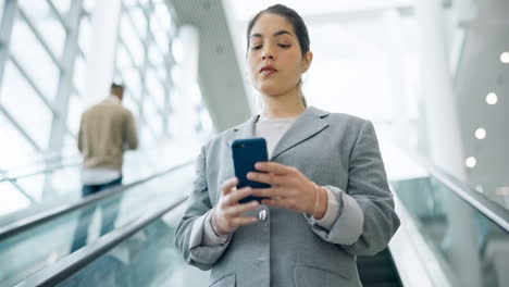 escalator, phone and a happy business woman