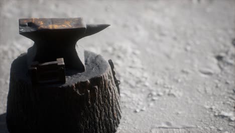 old anvil attached to a stump