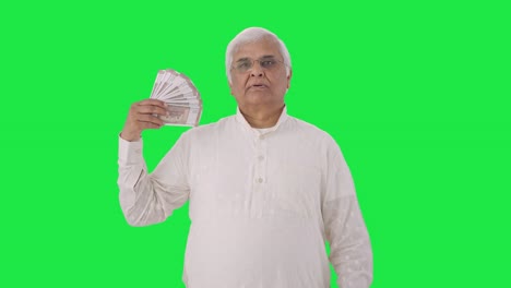 Indian-old-man-using-money-as-fan-Green-screen