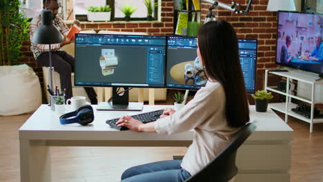 Professional industrial designer working with CAD software on dual monitors