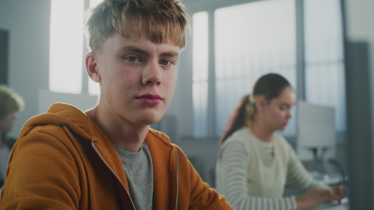 Handsome Student Works on Developing Game in Classroom