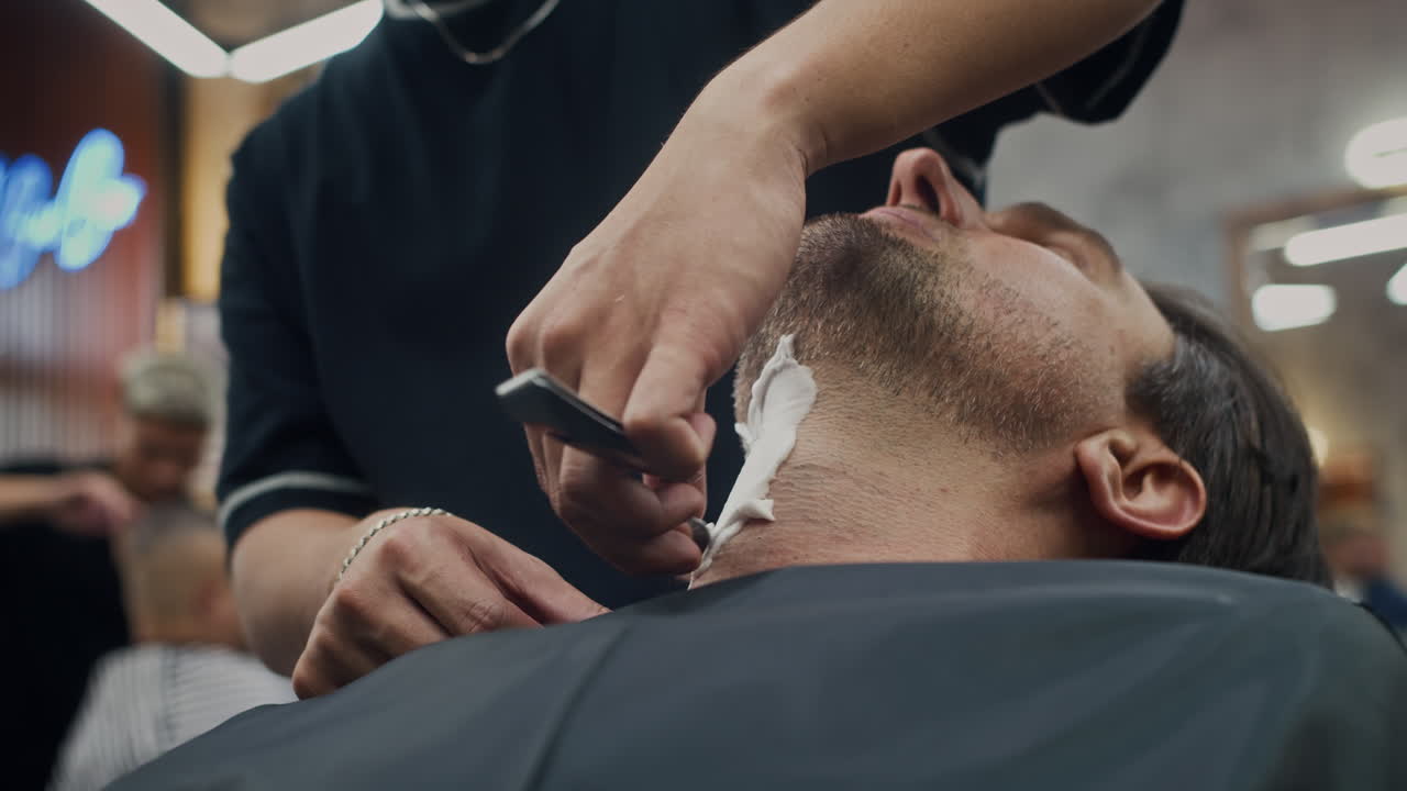 Man Getting Shaved by Barber