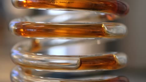 close-up of a spiral glass condenser
