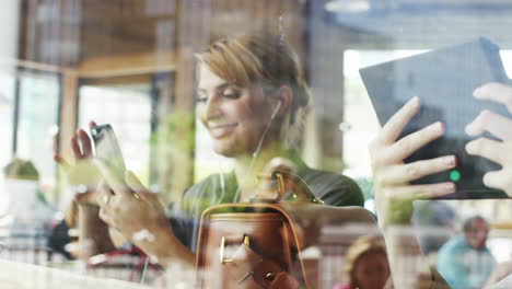 Beautiful-woman-video-messaging-conference-call-tablet-in-cafe