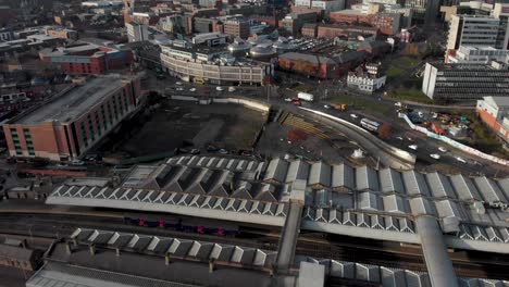 drone shot above the city of sheffield, panning over the train station, sheffield hallam, park hill and more