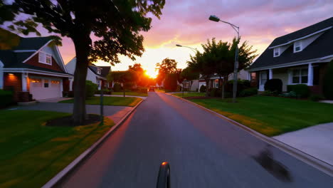 sunset drive through suburban neighborhood