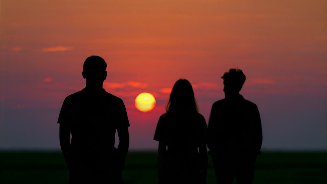 Friends Silhouettes at Sunset