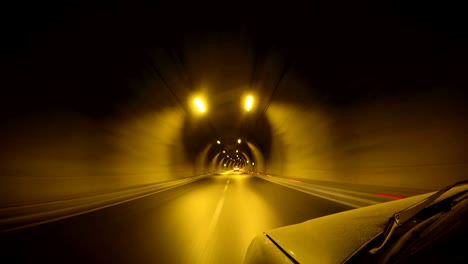 looping three times in to a tunnel with a car and attached camera at night.