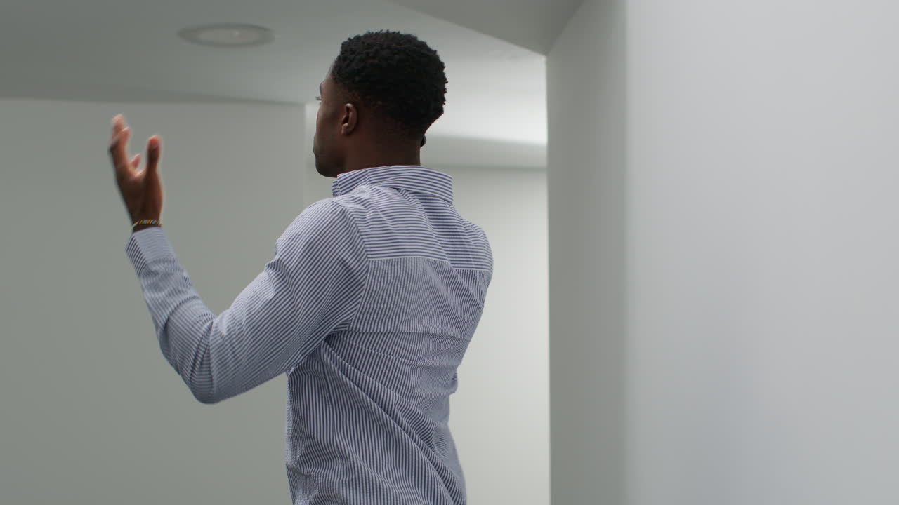 Young Businessman In Office Talking On Mobile Phone Reacting To Bad News Looking Unhappy And Depressed 5