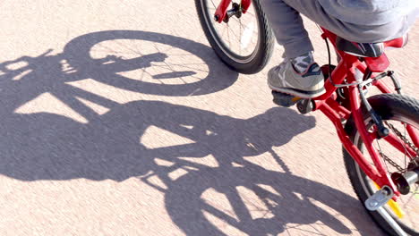 a small girl riding a bike