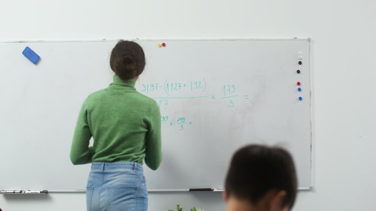 Teacher and students at school
