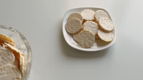 round cookies in white chocolate on a white table. sweet morning.