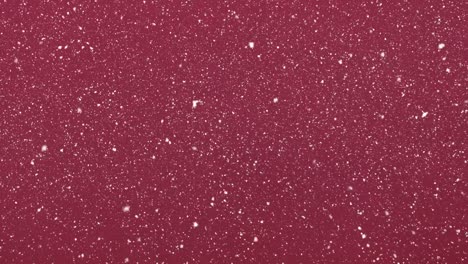 Animation-of-snow-falling-in-seamless-loop-over-red-background