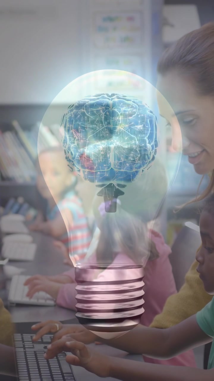 Vertical video: Class typing keyboards sparking lightbulb brain rotating to learn, teacher guiding