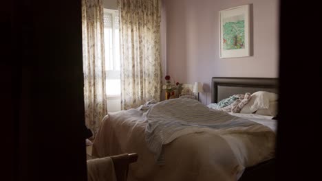 empty comfy family bedroom interior apartment with curtains and natural light no people during the day wide shot