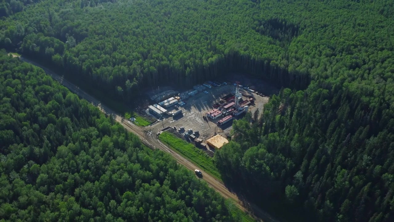 Oil and Gas Lease Pad in the Woods with Tree Shadows, Alberta, Canada