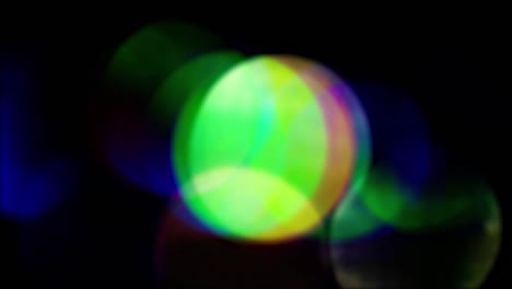 light transmits bokeh of sparkling flickering lights. soft colorful light leak. colored circles in the center of the screen