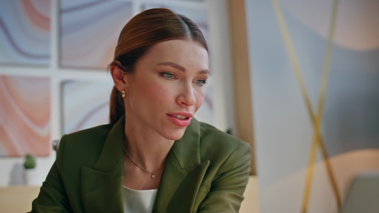 Joyful woman communicating video conference online at creative agency closeup