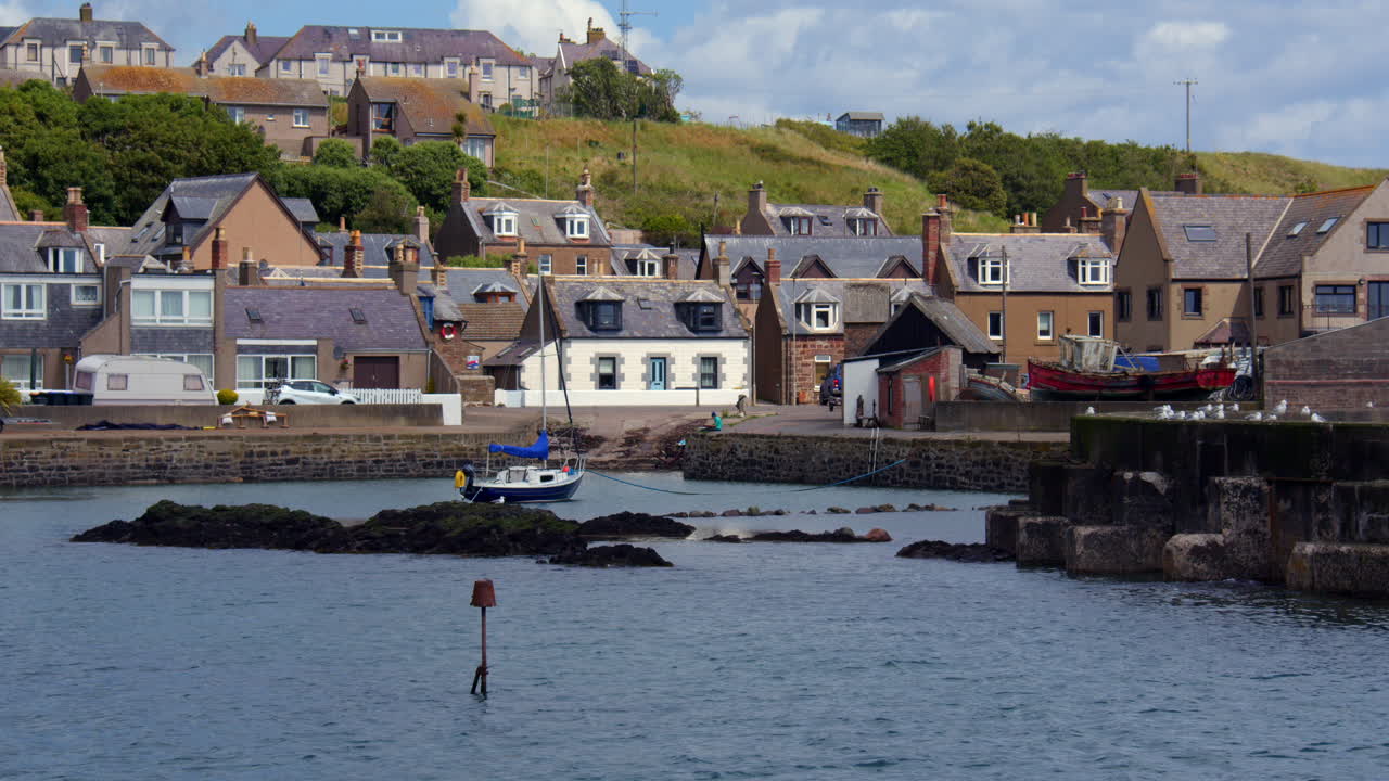 Wide shot looking at the Harbour and Gourdon from the pier
