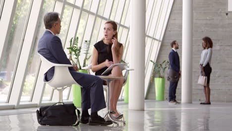 Business-Meeting-In-Busy-Office-Foyer-Area-Shot-On-R3D