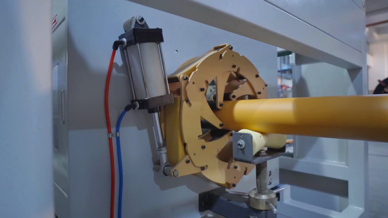 Close-up of Industrial Machinery and Plastic Pipe Production