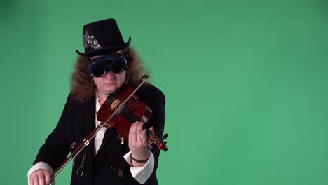 a violinist in a black suit, hat and original glasses plays the violin masterly. the man touches the strings with a bow to create a melody. green screen chroma key. slow motion. close up