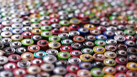 rotation around a group of colored batteries recycled batteries rotation around a group of colored batteries disposal of hazardous waste