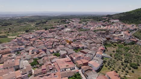 Jara&iacute;z de la Vera aerial view orbiting colourful red tiled rooftops of the scenic Spanish town in North East C&aacute;ceres