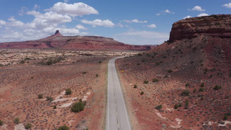 Scenic-route-95-and-red-rocky-mountain-in-background,-Utah