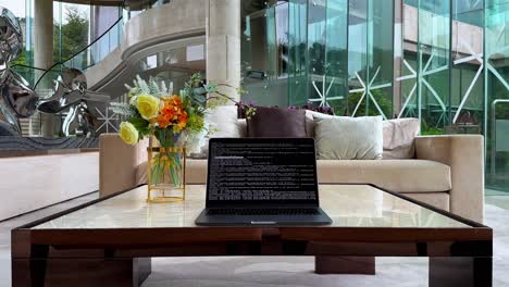 macbook in upscale mansion runs terminal commands and coding sequences