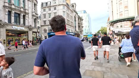 people walking and interacting on a city street