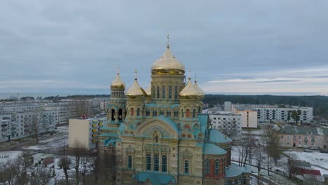 aerial establishing view of orthodox , orbiting drone shot moving right