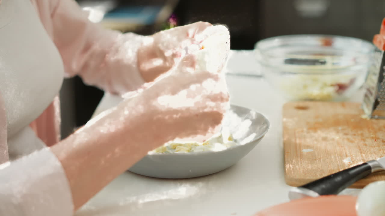 Preparing a Salad with Chopped Eggs